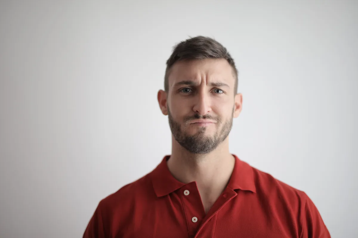 Man looking thoughtfully at the camera